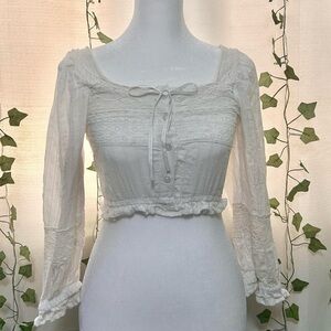 Coquette cropped top with button-up front and ruffled hem